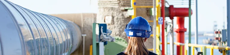 Enagás operator walking through a terminal