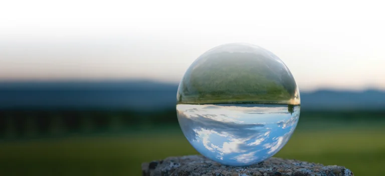 Drop of water reflecting a landscape
