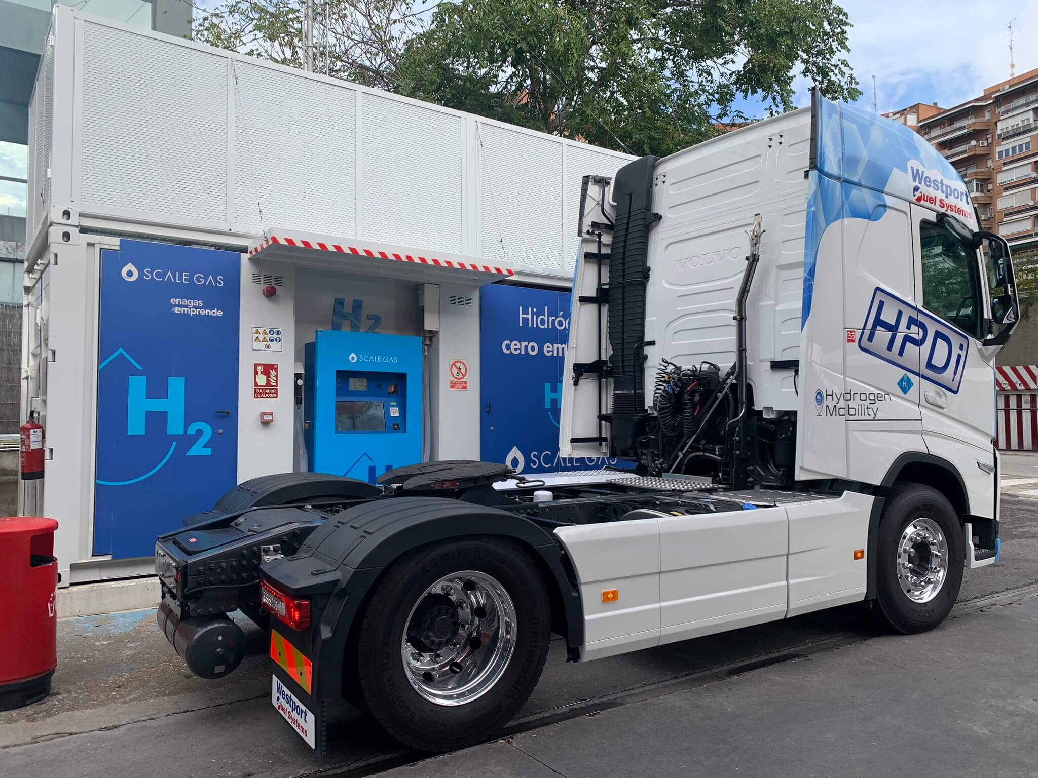 A hydrogen trailer refilling in a station