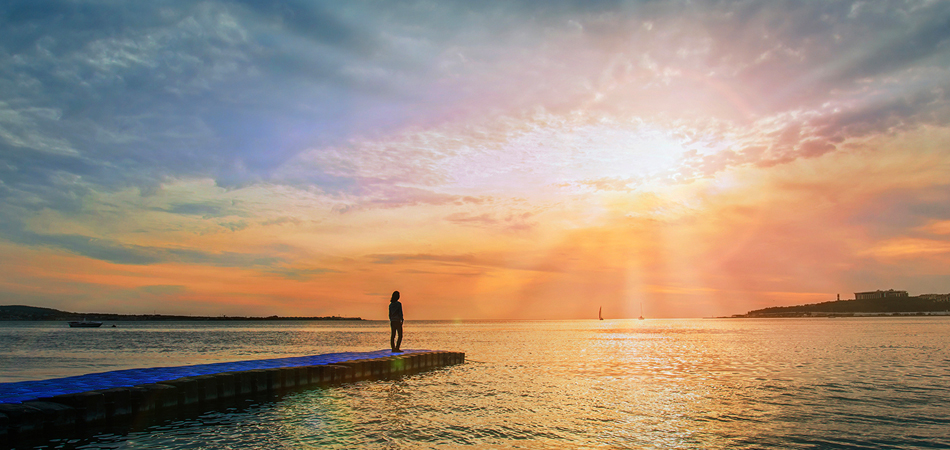 A woman watching the sunset