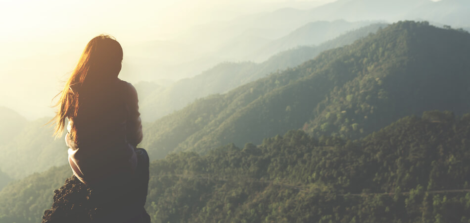 Woman on her back looking at the landscape