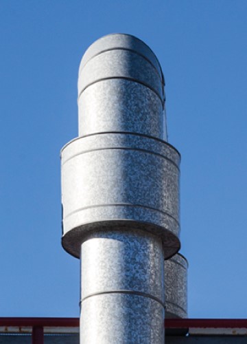 Part of a pipe and blue sky in the background