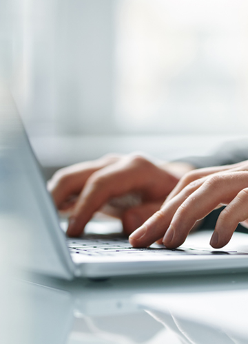  Hands typing on a keyboard