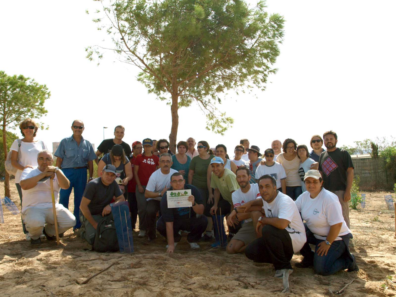  Enagás Professionals of the Cartagena Plant at a reforestation activity, along with a group of people with disabilities